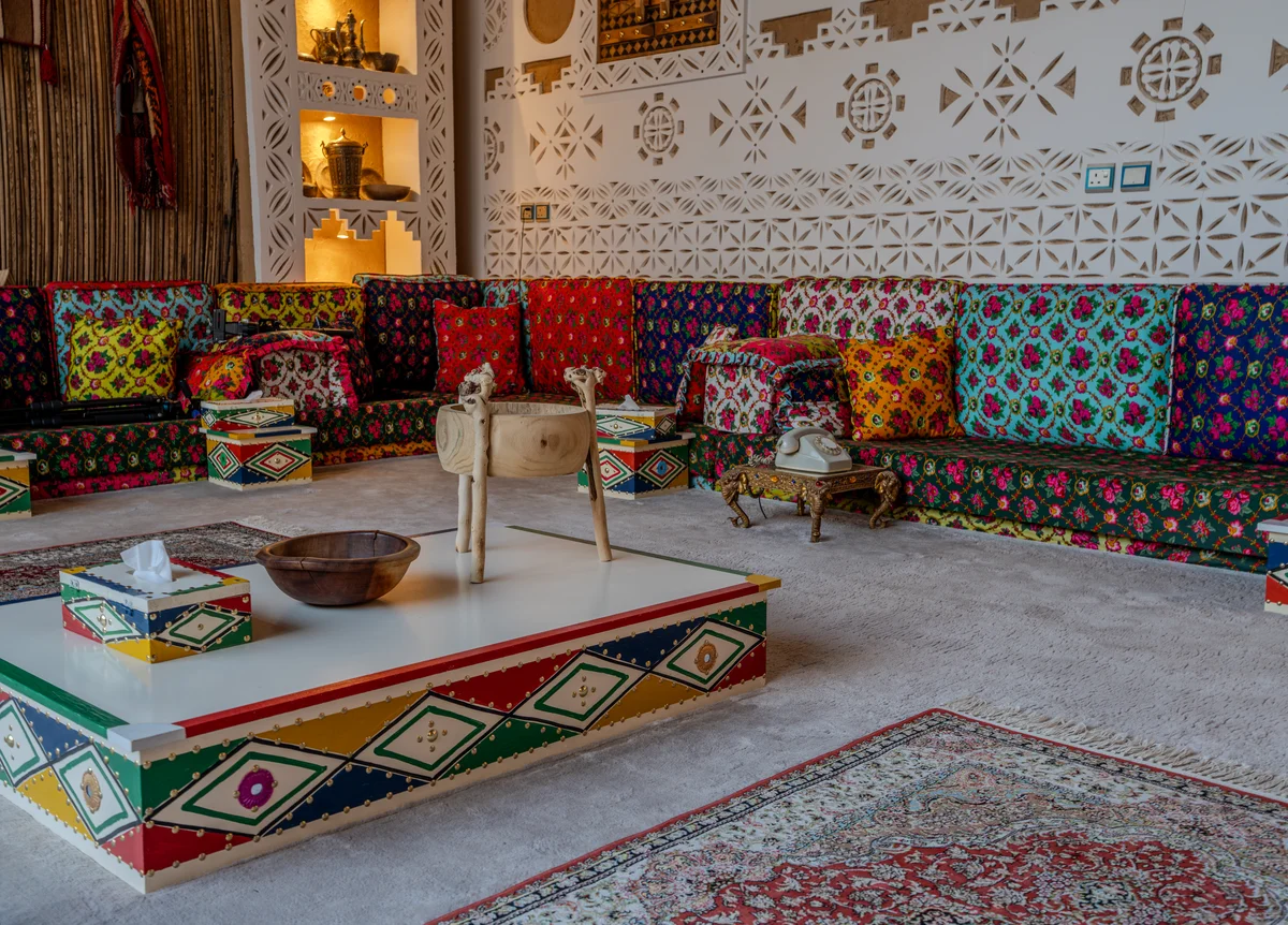 Grand staircase with polished wood and detailed metalwork.