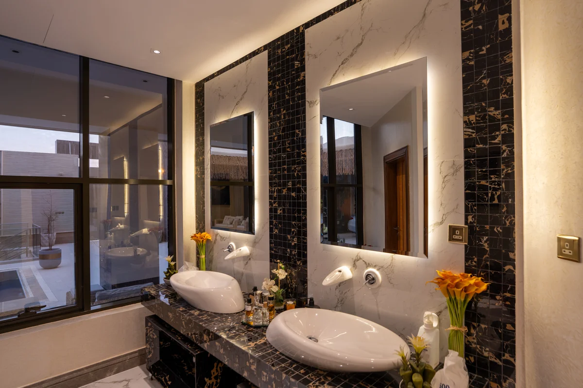 Open concept lounge with statement lighting.